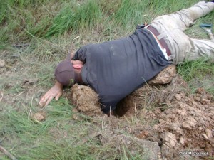 Lying on the ground, stretching down with your shoulder in the hole can yield some great results