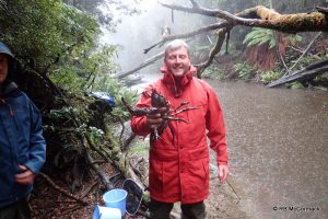 Despite the rain Craig Burnes is happy with this Astacopsis gouldi he caught